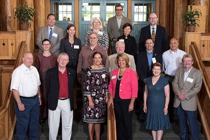 Group photo from 2015 retreat.  First row, left to right: Don Steeples, James Tracy, Julie Nagel, Ruth Watkins, Mabel Rice, Wolfgang Kliemann Second row, left to right: Evelyn Haaheim, Neal Kingston, John Colombo, Steve Goddard, Chris Morphew Third row, left to right: Hinrich Staecker, Alexandra Thomas, Mary Rezac, Rick Barohn, Deb Teeter, Dan Reed