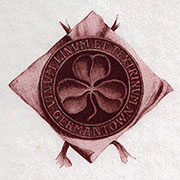 The seal of the Society for German-American Studies showing a clover leaf surrounded by the text Vinum Linum Textrinum Germantown